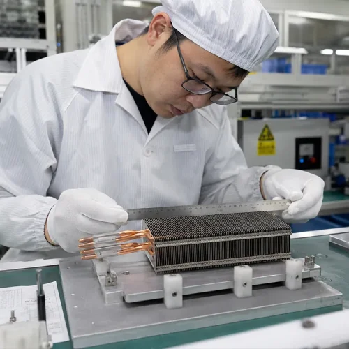 worker-is-checking-the-size-of-heat-pipe-cooling-module